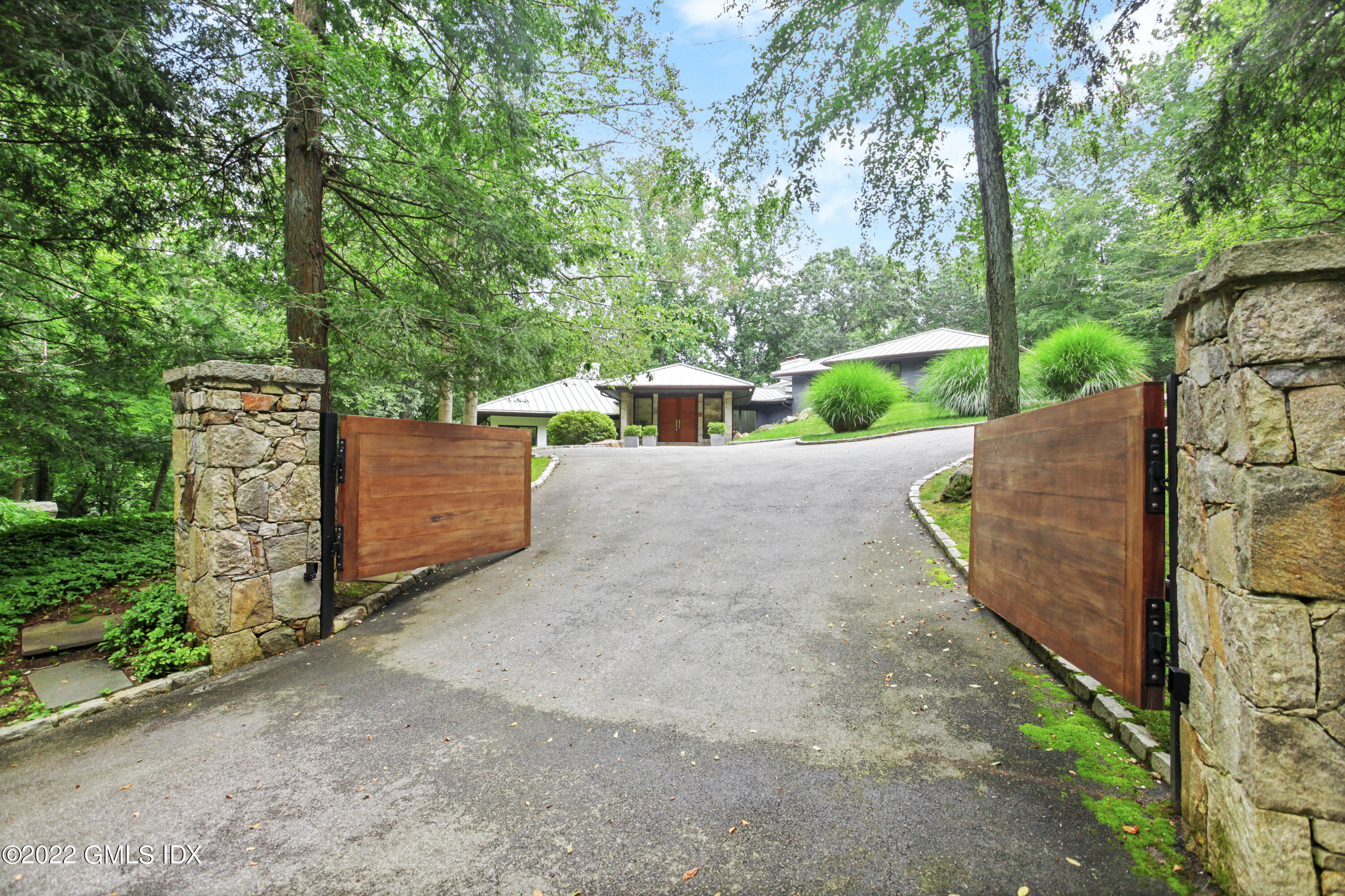 4 Chateau Ridge Road Greenwich, CT 06831 - Photo 2 of 37 a view of a backyard
