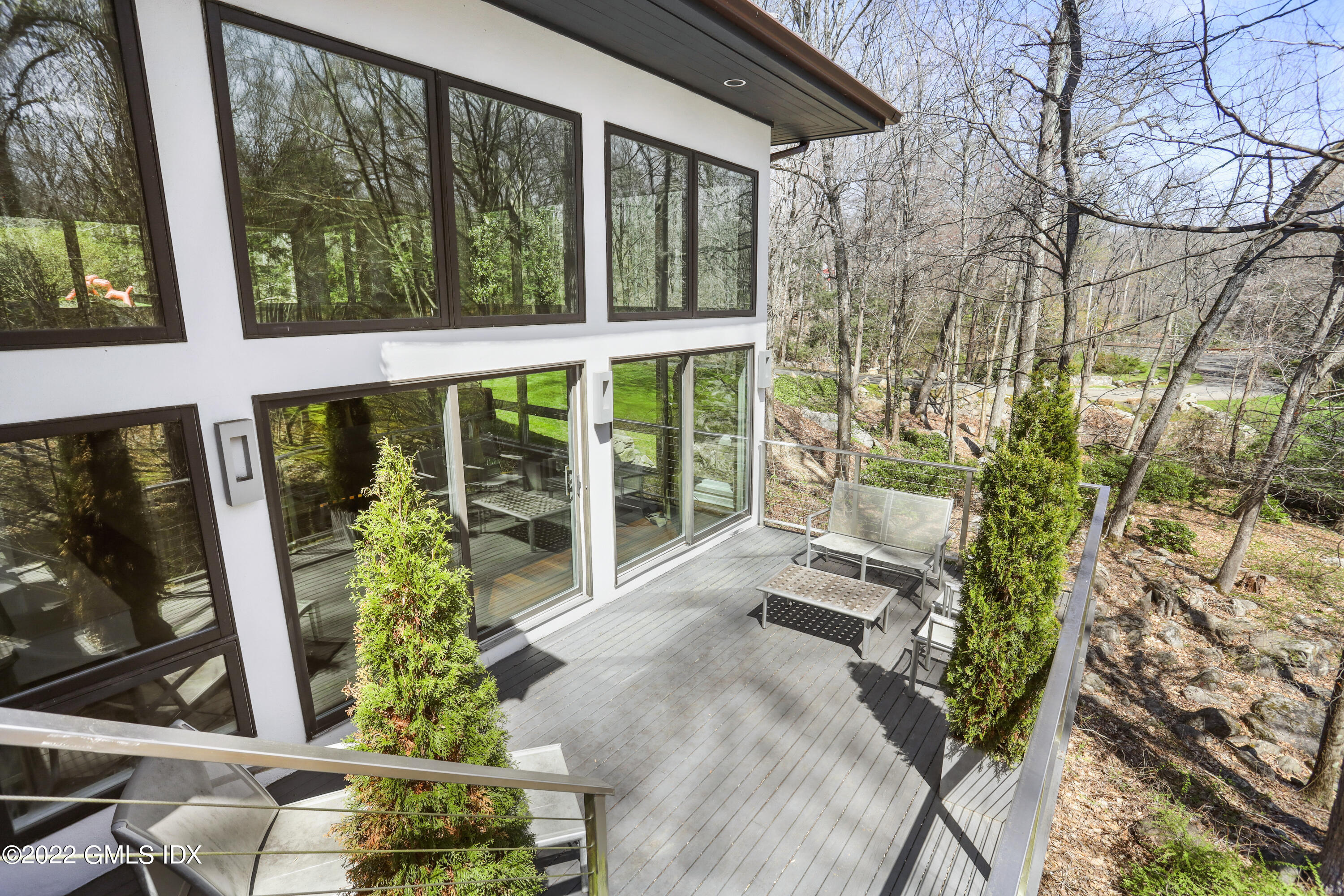 4 Chateau Ridge Road Greenwich, CT 06831 - Photo 22 of 37 a front view of a house with garden