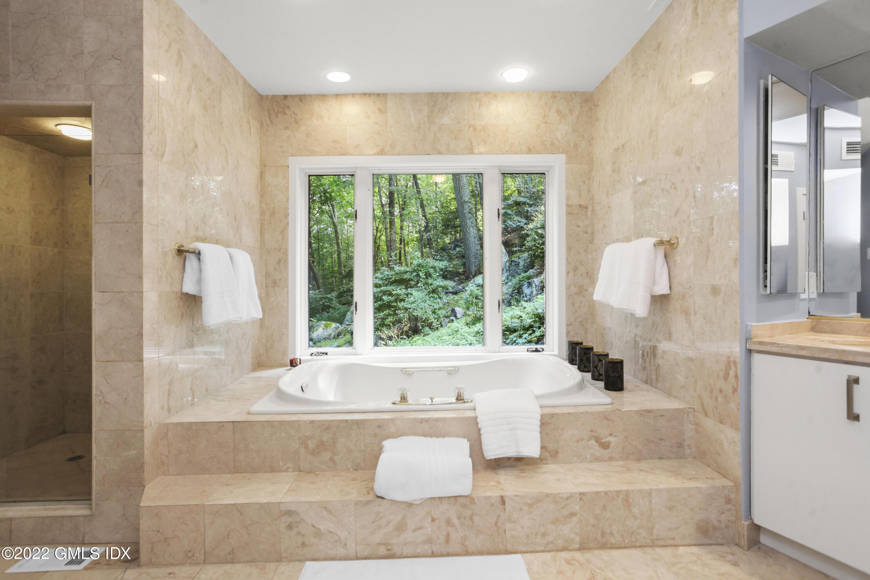 4 Chateau Ridge Road Greenwich, CT 06831 - Photo 24 of 37 a bathroom with a bathtub and a shower