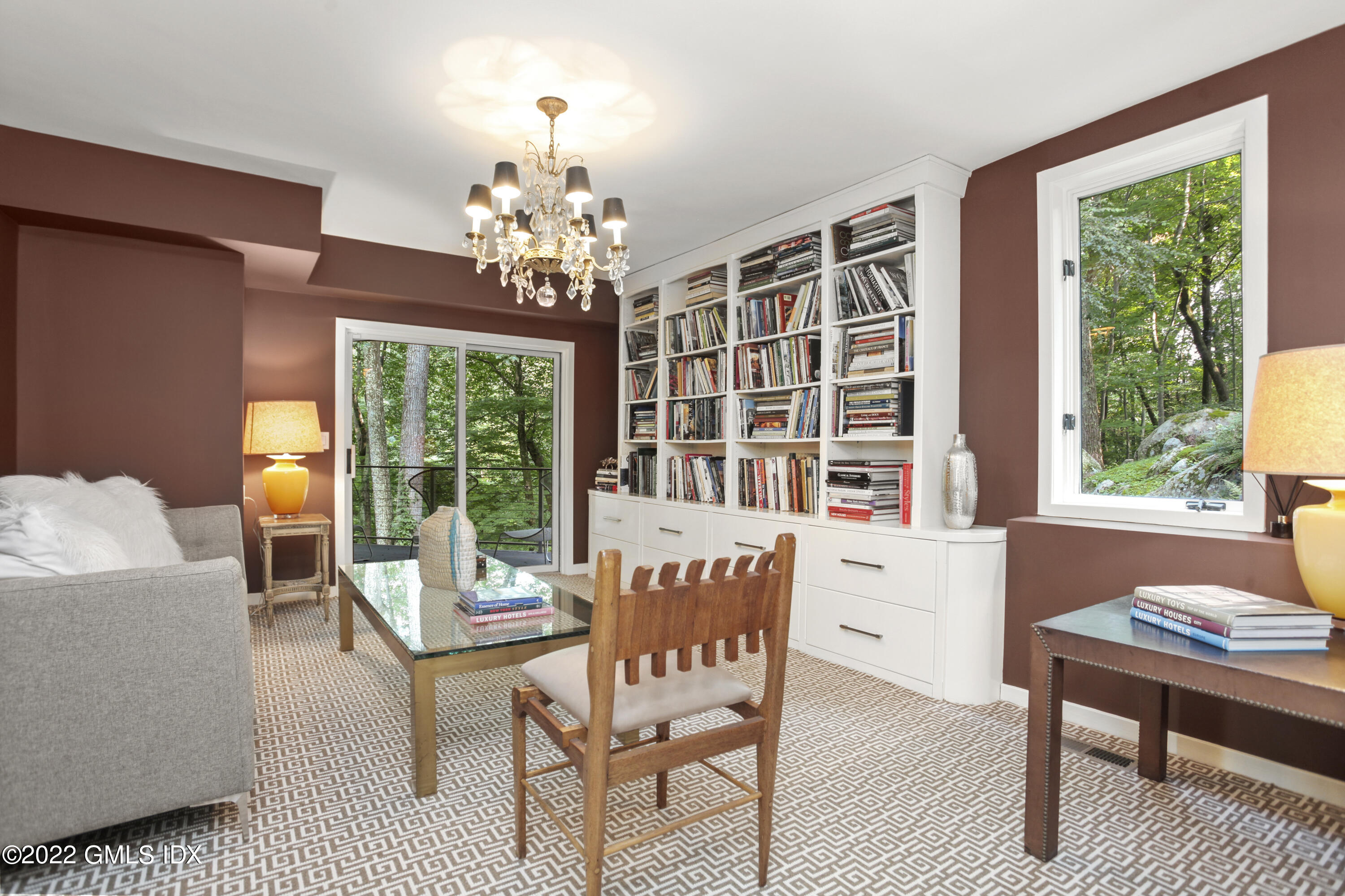 4 Chateau Ridge Road Greenwich, CT 06831 - Photo 25 of 37 a living room with furniture and a chandelier