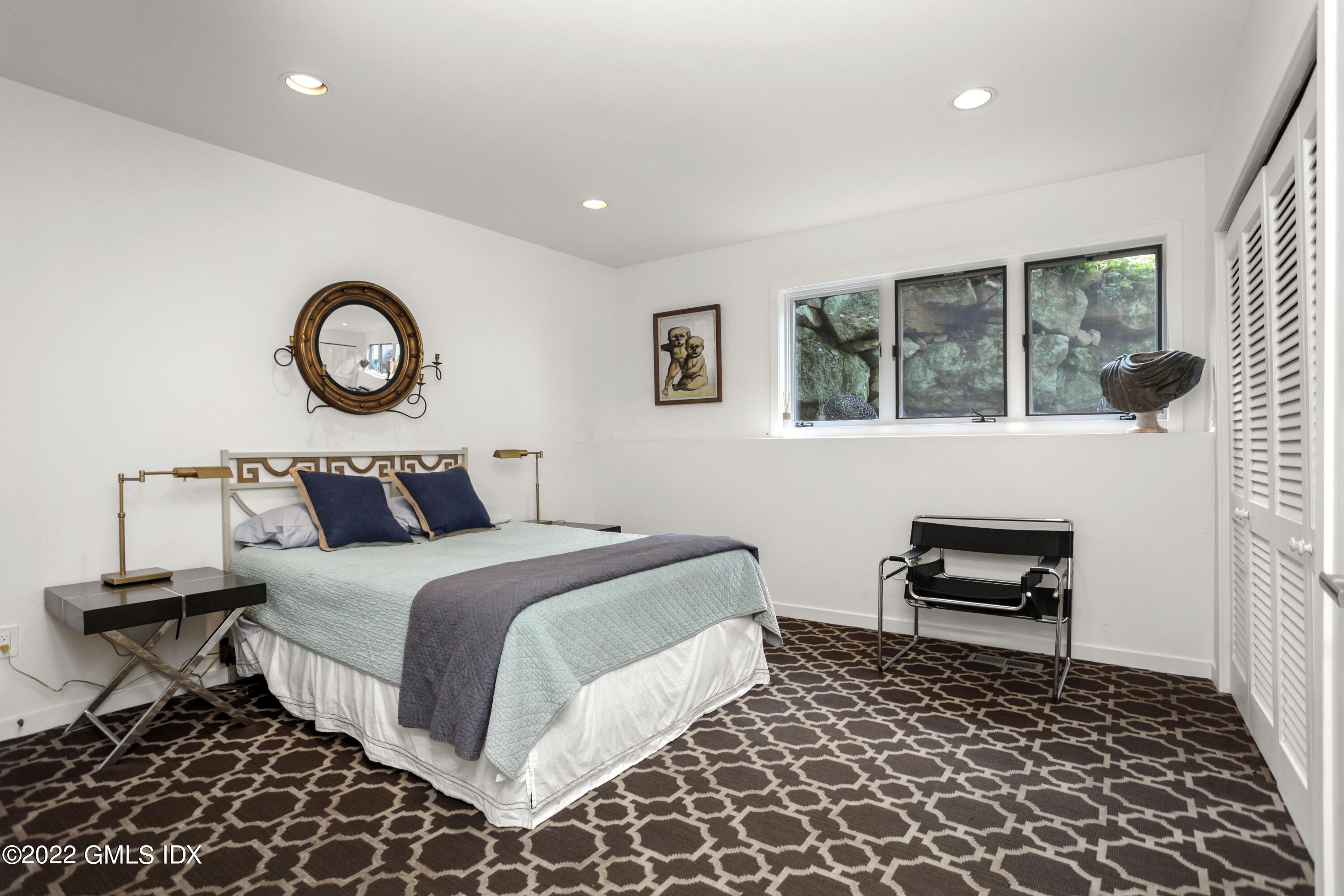 4 Chateau Ridge Road Greenwich, CT 06831 - Photo 27 of 37 a bedroom with a bed and a window