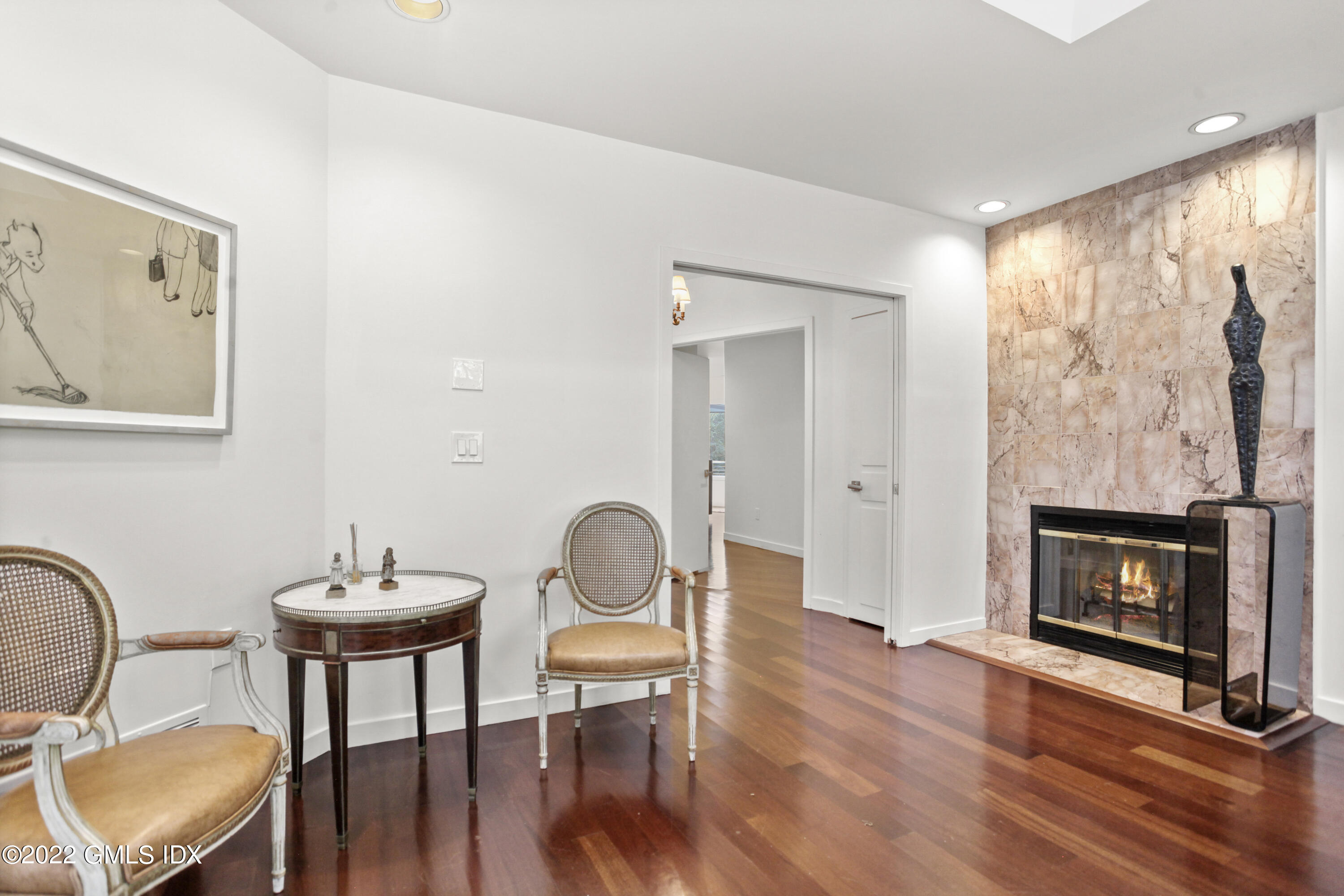 4 Chateau Ridge Road Greenwich, CT 06831 - Photo 31 of 37 a living room with furniture and a fireplace