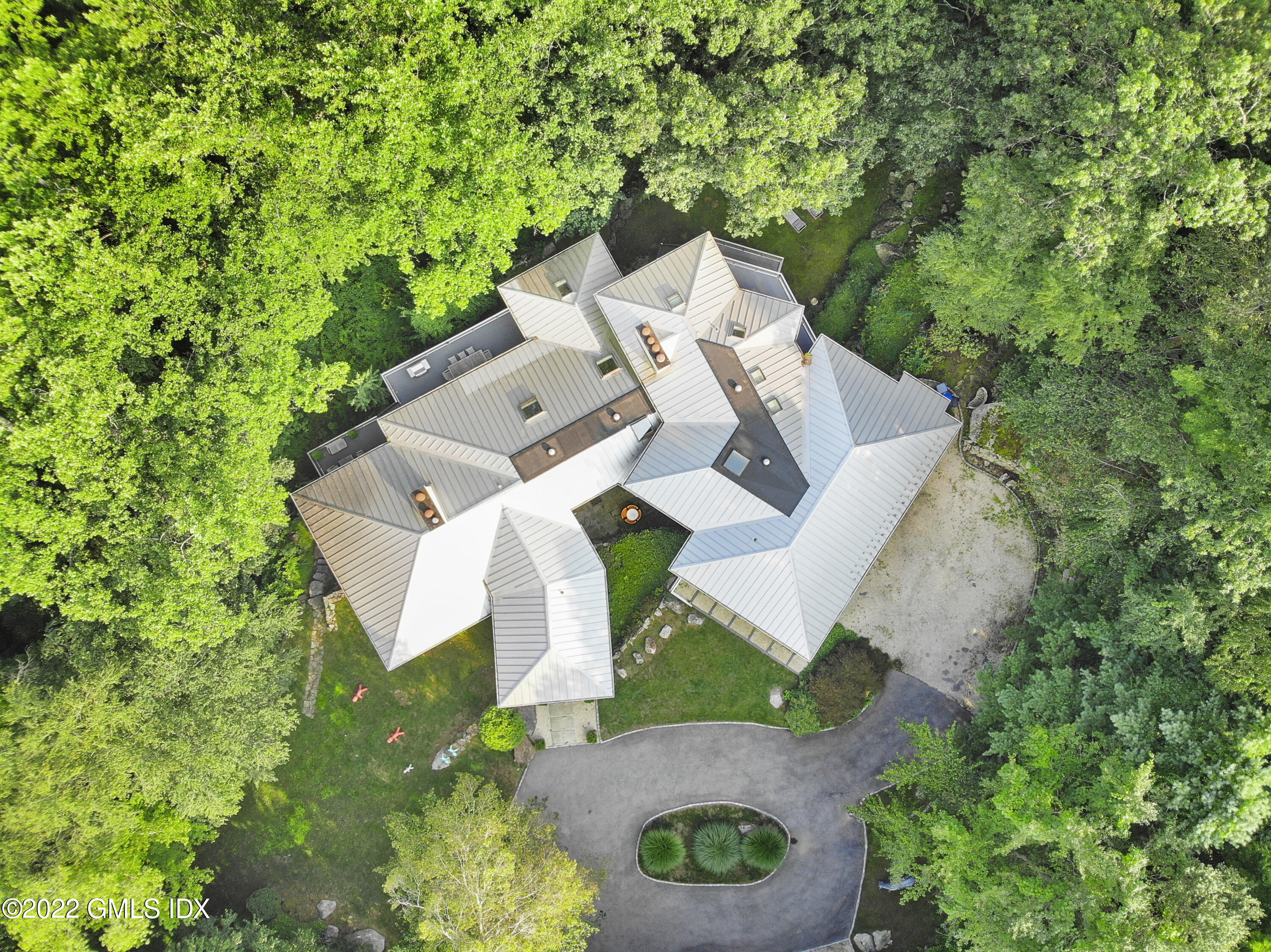 4 Chateau Ridge Road Greenwich, CT 06831 - Photo 8 of 37 an aerial view of a house with yard and outdoor seating