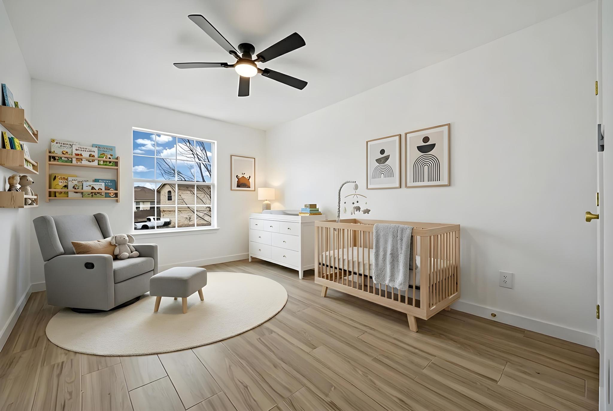 13501 Sierra Wind Lane Elgin, TX 78621 - Photo 11 of 19 Bright room featuring wood-finish flooring, white walls, and a multi-pane window