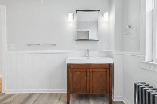 a bathroom with a sink and a mirror