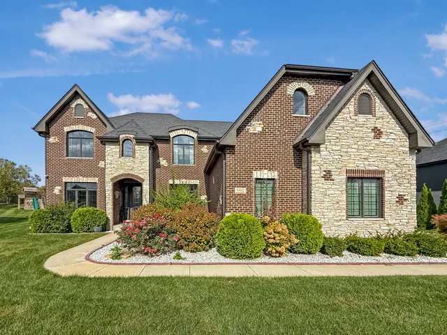 a front view of a house with a yard