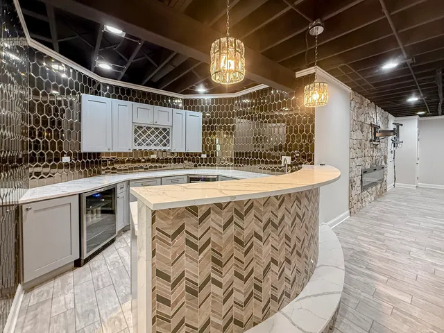 a kitchen with a stove a cabinets and wooden floor
