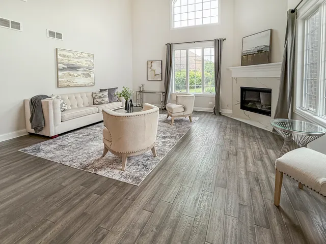 a living room with furniture and a fireplace