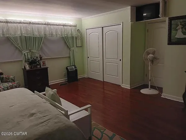 a bedroom with a bed and a walk in closet