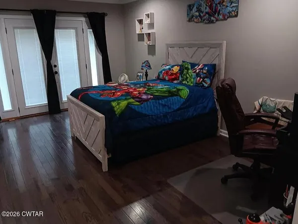 a room with furniture and wooden floor