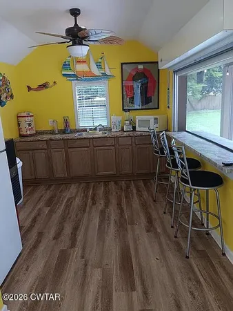 a room with lots of furniture and clutter