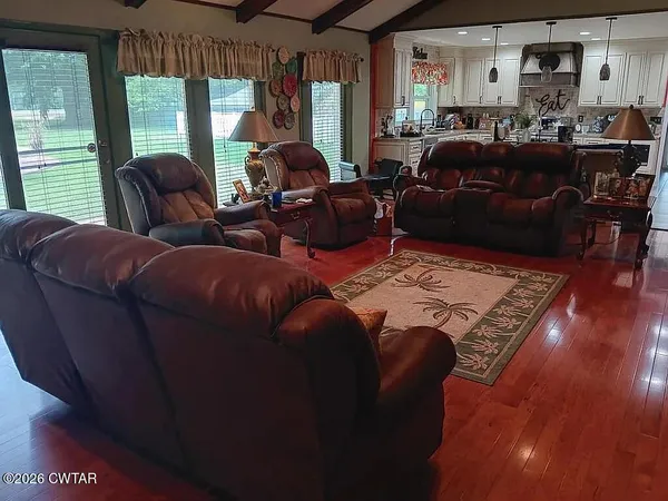 a living room with furniture and a large window