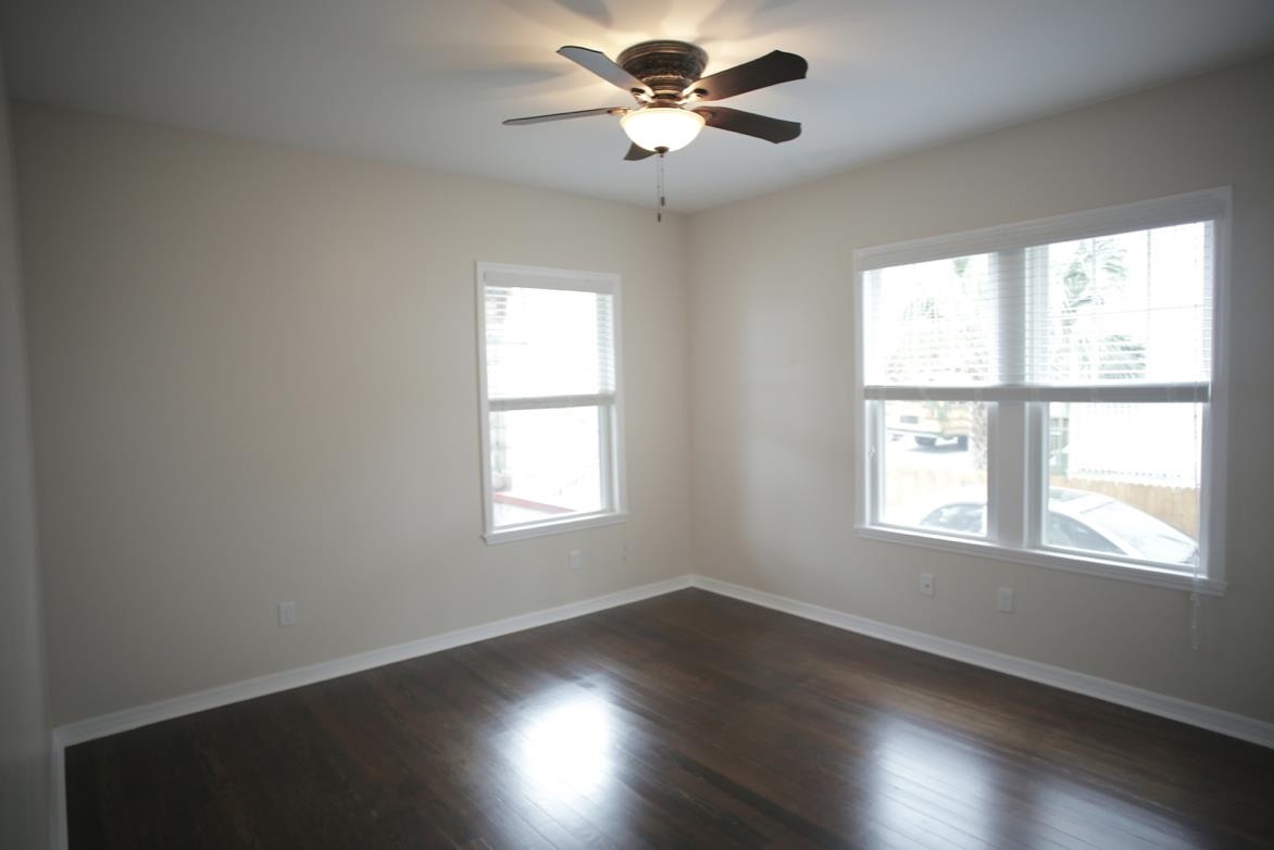 78 Riberia Street St. Augustine, FL 32084 - Photo 18 of 38 a view of an empty room with wooden floor and a window