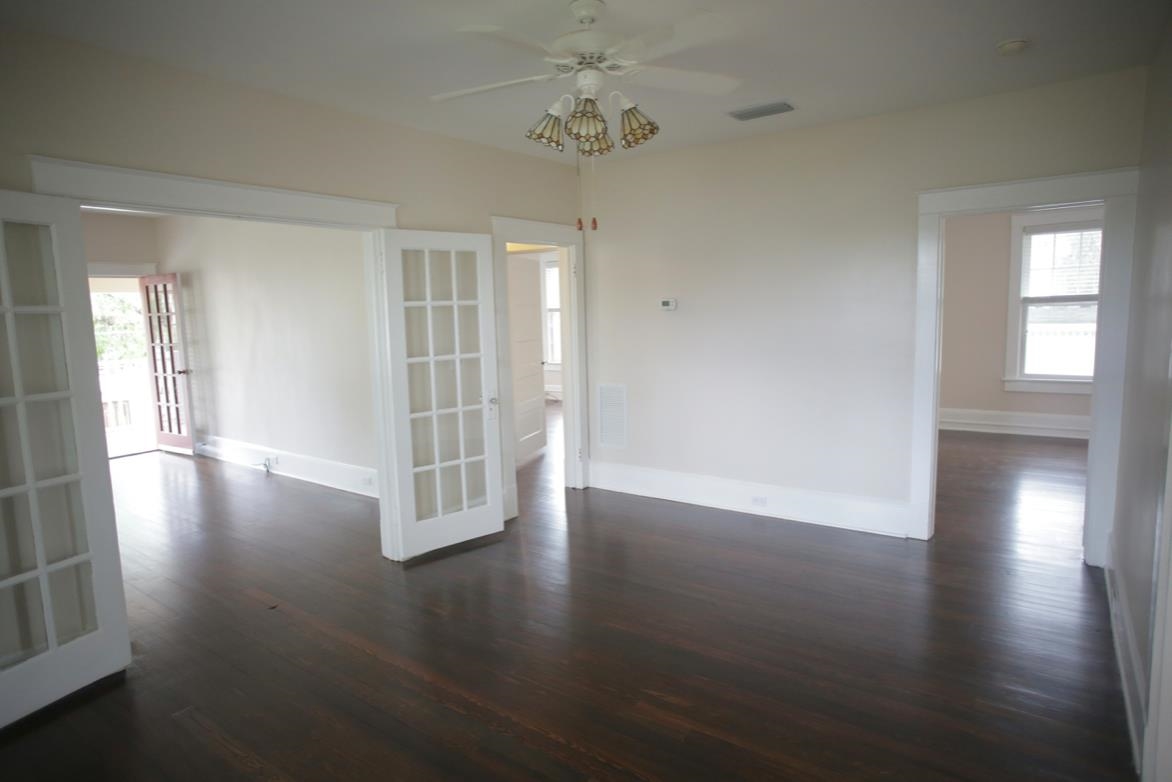 78 Riberia Street St. Augustine, FL 32084 - Photo 24 of 38 an empty room with wooden floor and windows