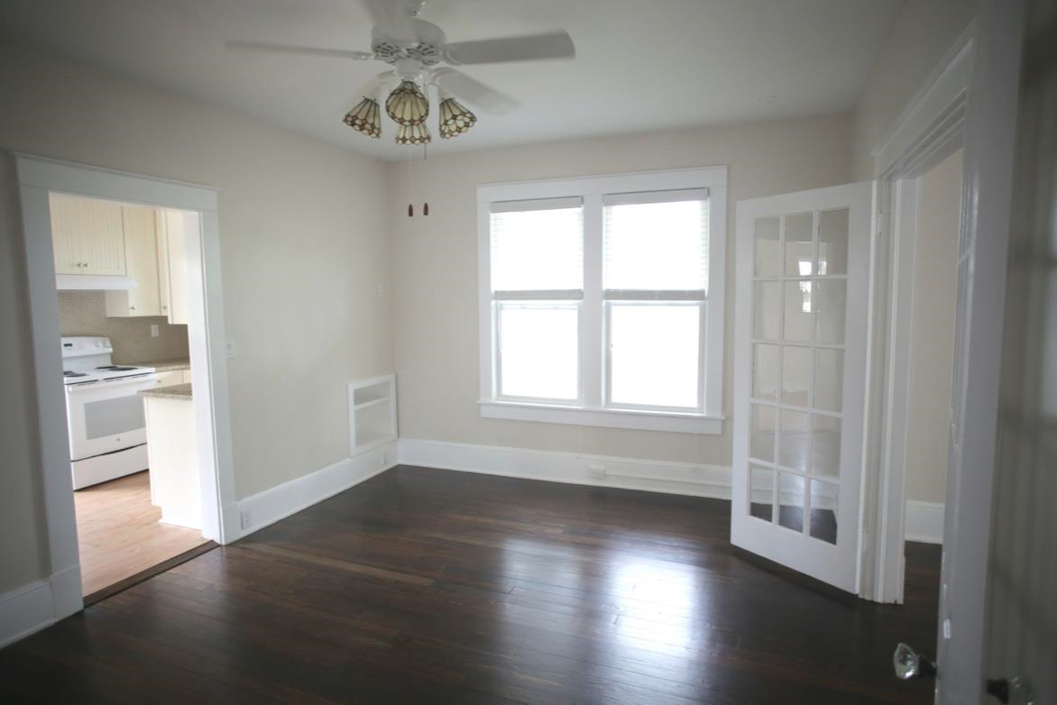 78 Riberia Street St. Augustine, FL 32084 - Photo 25 of 38 wooden floor in an empty room with a window