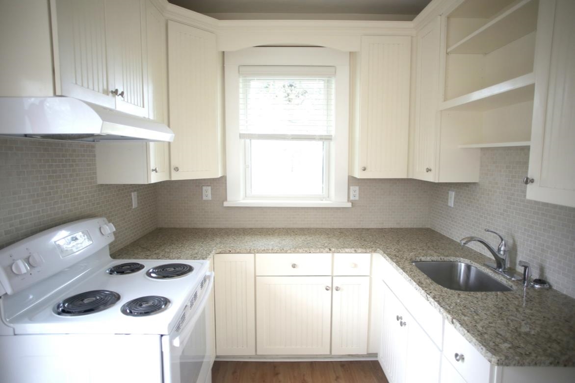 78 Riberia Street St. Augustine, FL 32084 - Photo 27 of 38 a kitchen with a sink a stove and cabinets