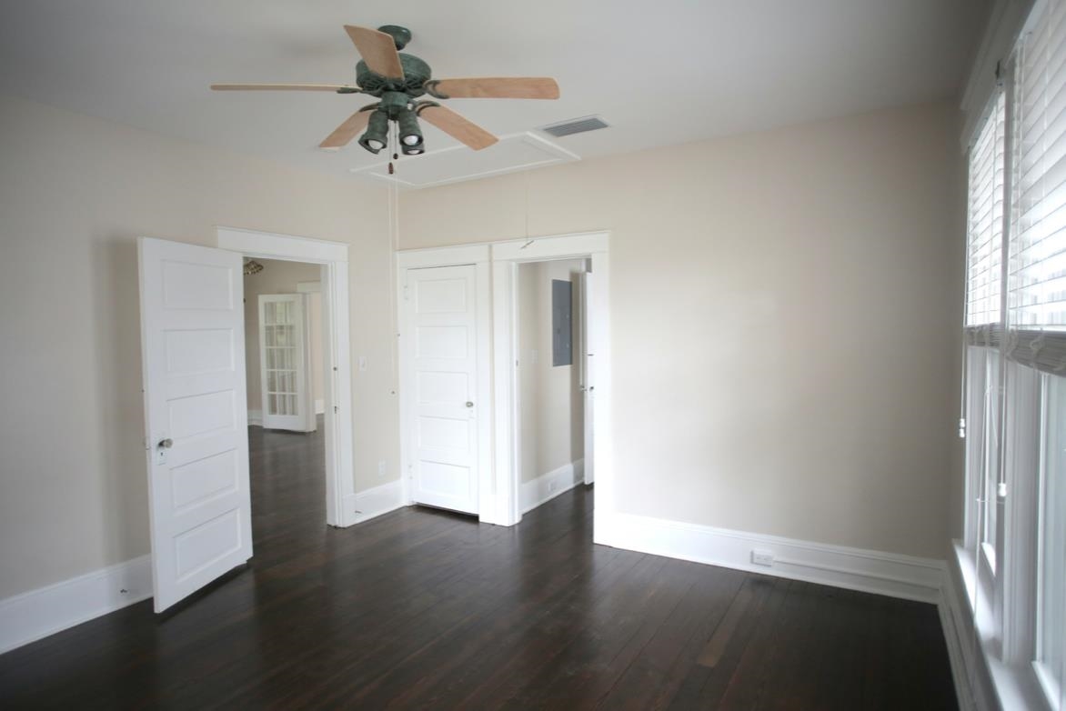78 Riberia Street St. Augustine, FL 32084 - Photo 30 of 38 a view of an empty room with a window and wooden floor