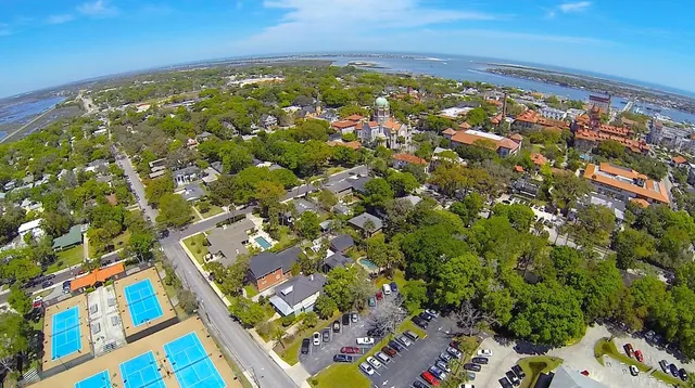 an aerial view of residential houses with outdoor space