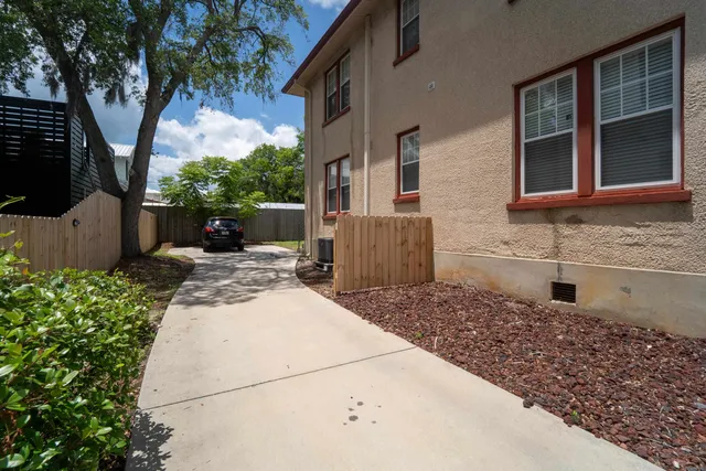a view of a house with wooden floor and a large window
