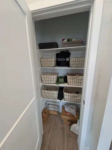 a shelf with cup and plates