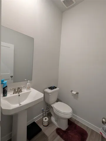 a bathroom with a sink and a toilet