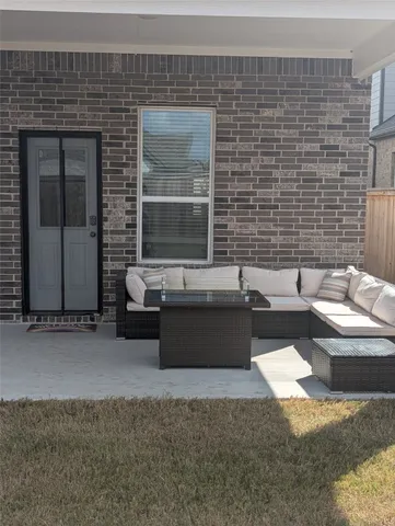 a living room with couches and a fireplace