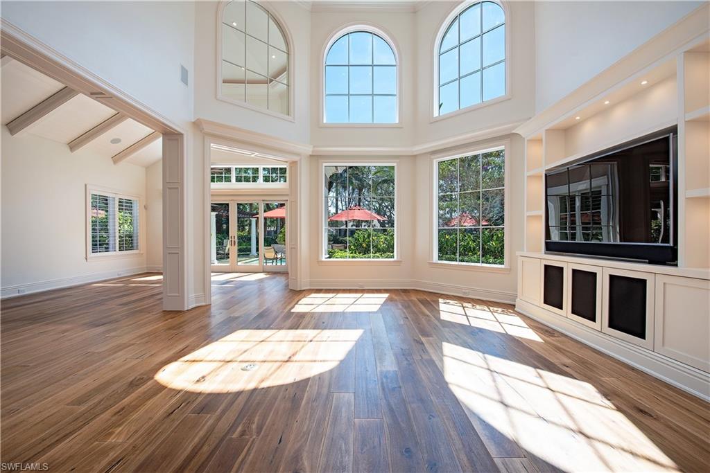 7100 Verde Way Naples, FL 34108 - Photo 6 of 18 a view of an house with wooden floor and a front door