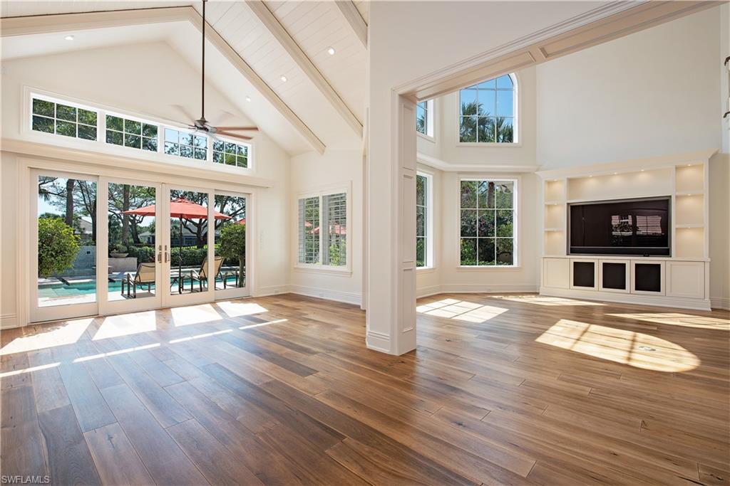 7100 Verde Way Naples, FL 34108 - Photo 7 of 18 a view of an apartment with wooden floor and a window