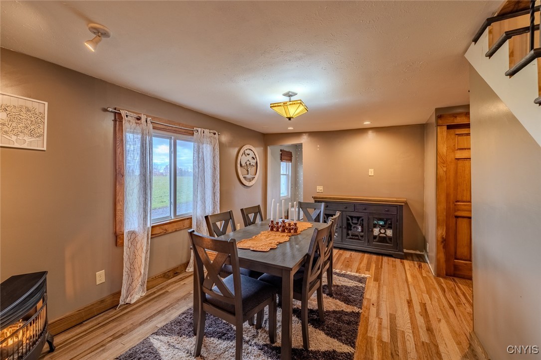 11407 Ferris Road Cato, NY 13033 - Photo 9 of 36 Full formal dining room equipped with a propane he