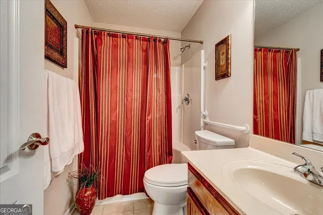 a bedroom with a bed and a table