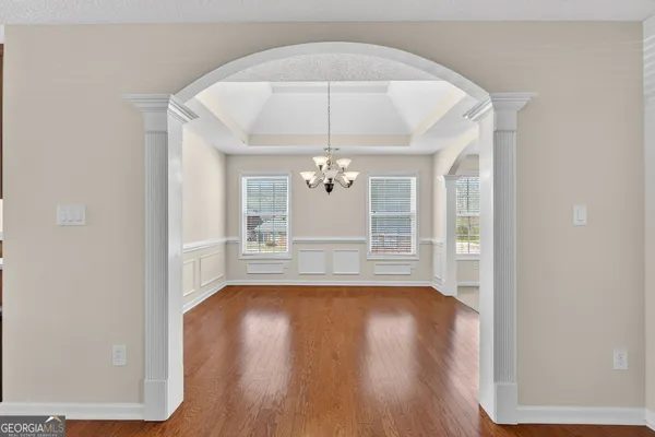 a bedroom with a bed and a table