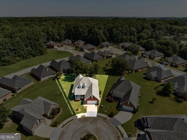 an aerial view of a house with garden space and outdoor space