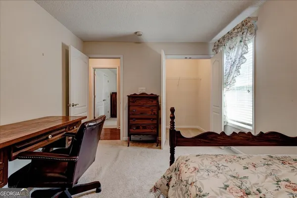 a bathroom with a bathtub and a window