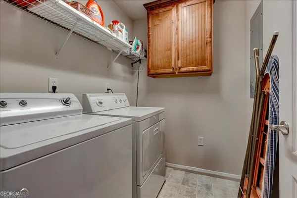 a bathroom with a granite countertop sink toilet a mirror and shower