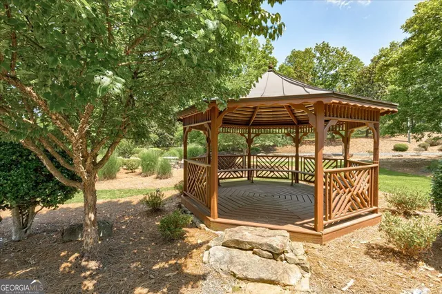a view of a backyard with plants and a patio