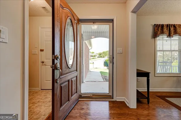 a kitchen with stainless steel appliances granite countertop wooden cabinets a sink and a stove
