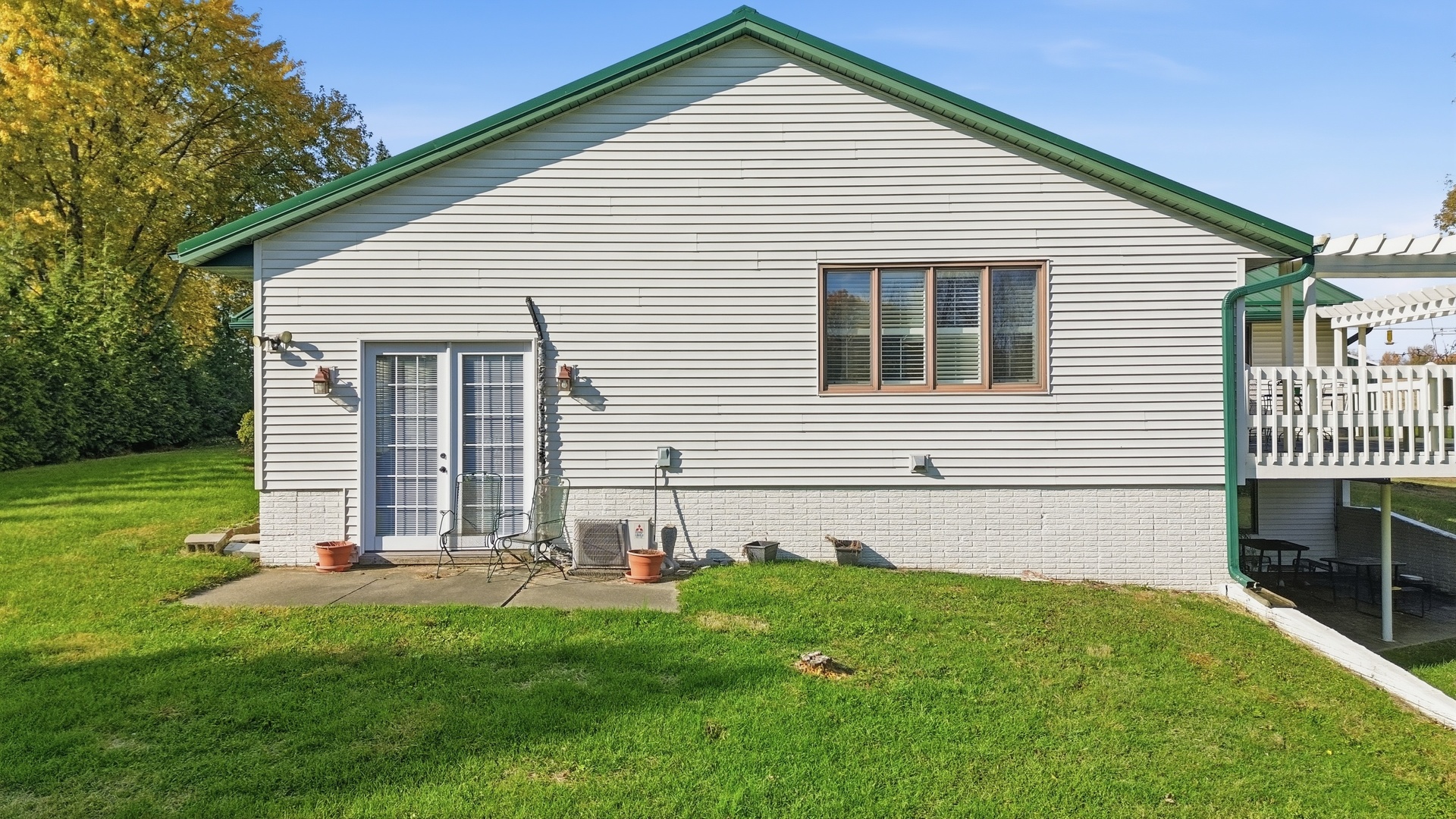 1764 Wolverine Road Dixon, IL 61021 - Photo 21 of 86 a front view of a house with a yard and trees