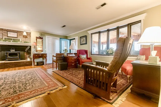 a view of a livingroom with an empty space and a window