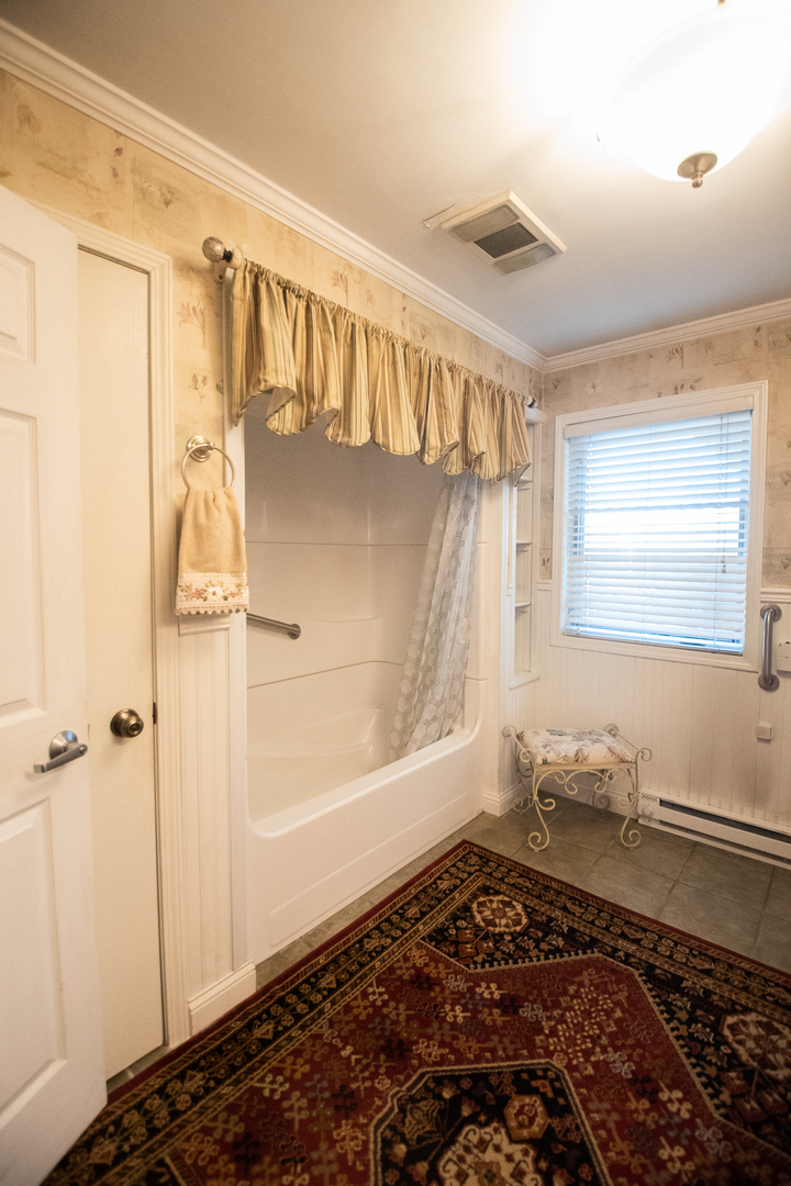 1764 Wolverine Road Dixon, IL 61021 - Photo 33 of 86 a bathroom with a bathtub and a shower