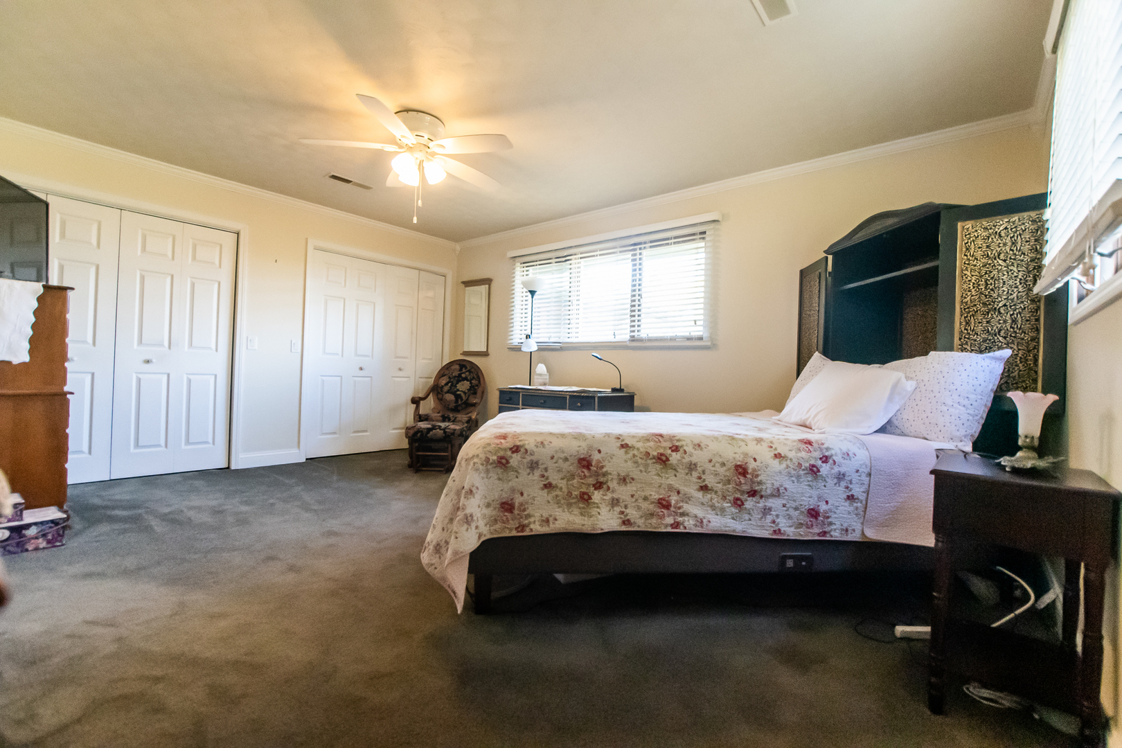 1764 Wolverine Road Dixon, IL 61021 - Photo 35 of 86 a spacious bedroom with a bed and a chandelier