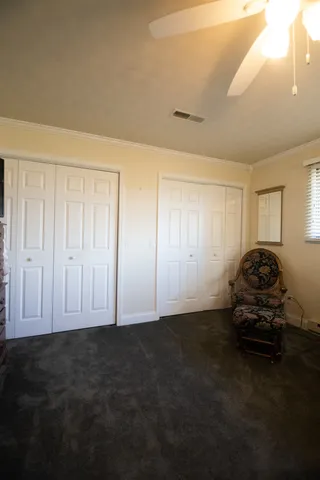 a view of a house with backyard and tree