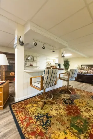 a bedroom with furniture and flat screen tv