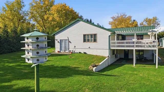 a view of a patio with a yard