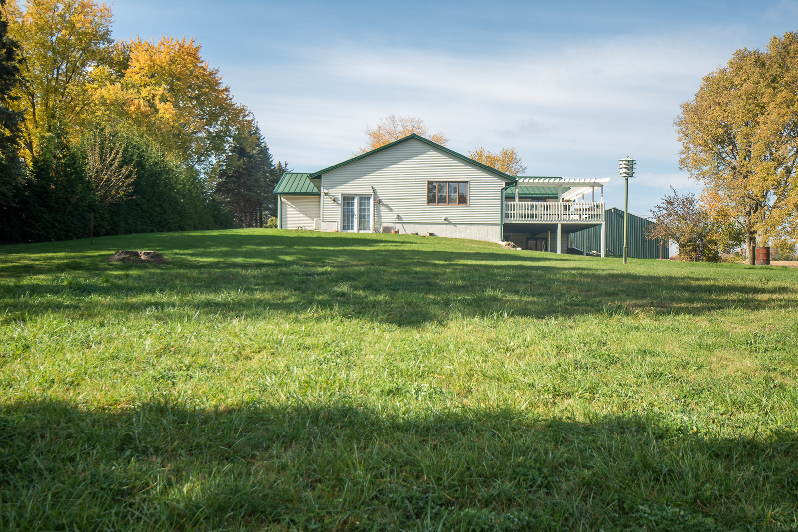 1764 Wolverine Road Dixon, IL 61021 - Photo 56 of 86 a front view of a house with a yard and trees