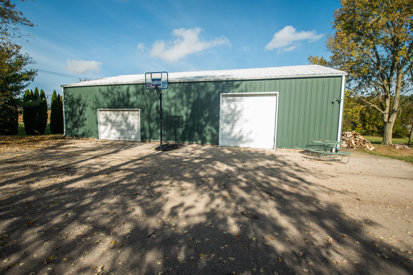 1764 Wolverine Road Dixon, IL 61021 - Photo 60 of 86 a view of a house with a big yard and potted plants