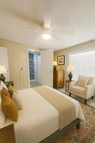 a bedroom with a bed and couch