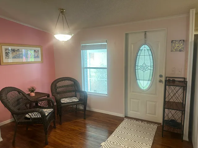 a view of a livingroom with furniture and wooden floor