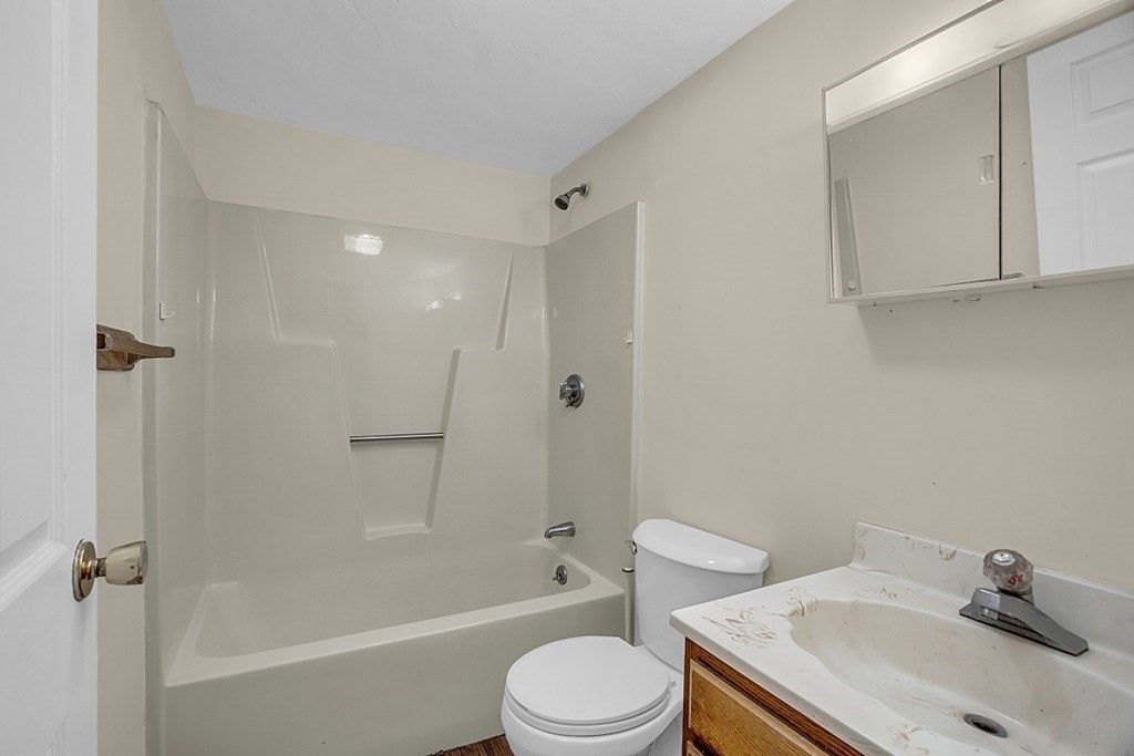11 Gibbs Street, Unit A6 Worcester, MA 01607 - Photo 13 of 26 a bathroom with a sink toilet and shower