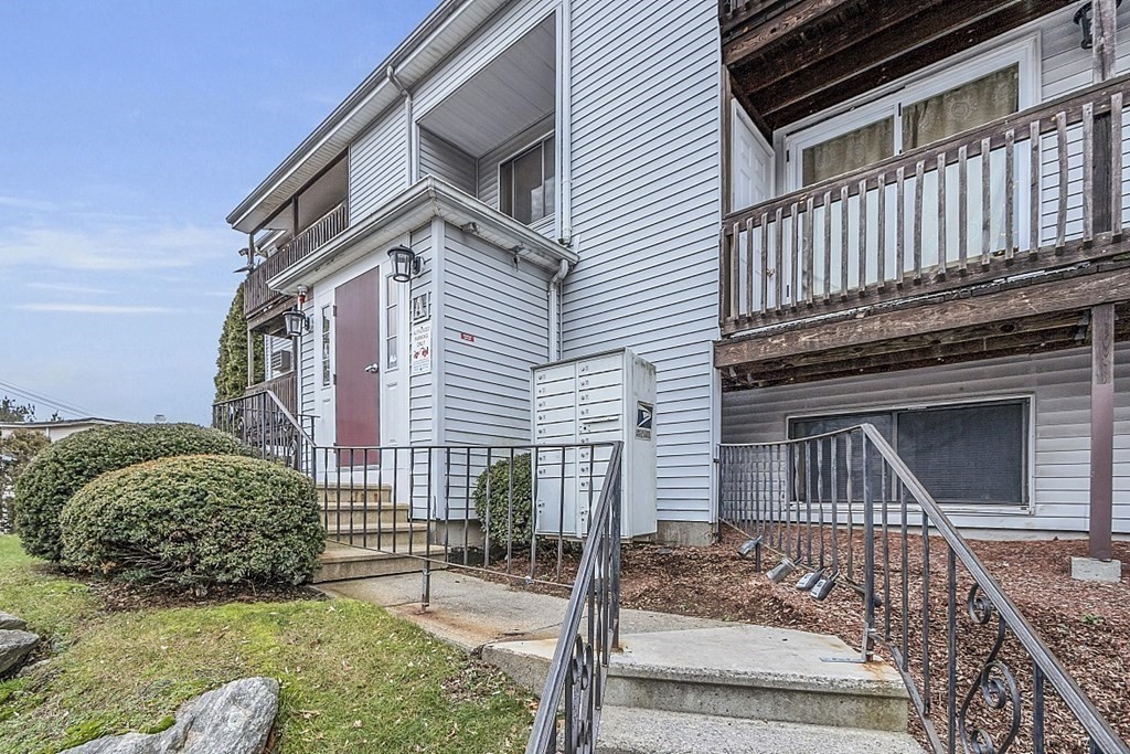 11 Gibbs Street, Unit A6 Worcester, MA 01607 - Photo 3 of 26 a front view of a house with garage