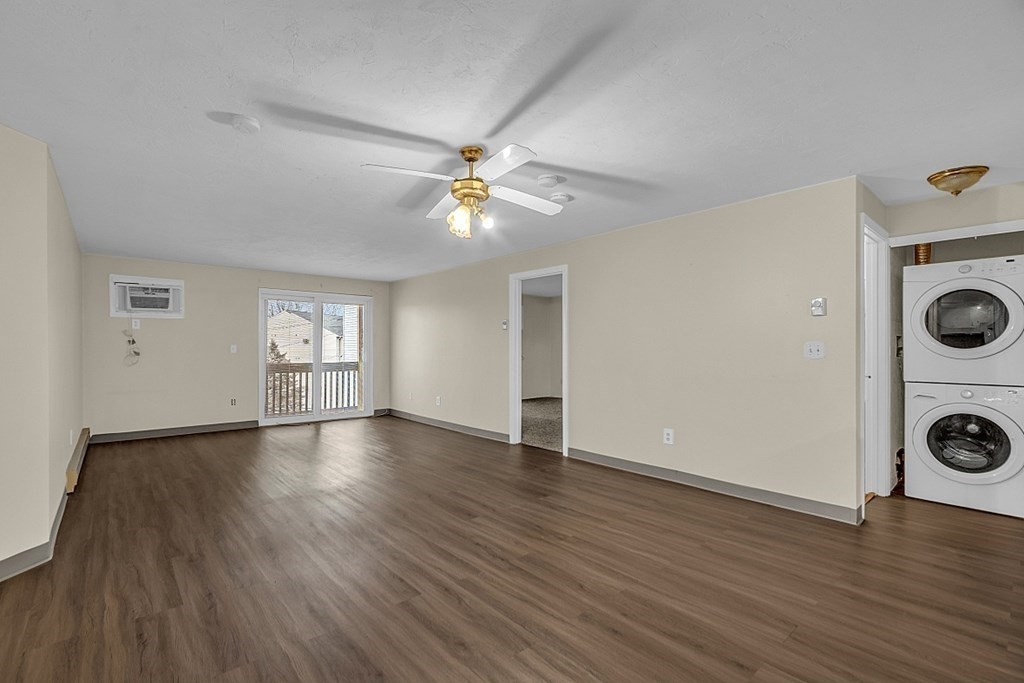 11 Gibbs Street, Unit A6 Worcester, MA 01607 - Photo 6 of 26 an empty room with wooden floor and window
